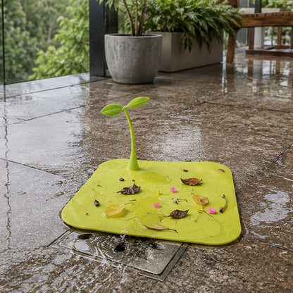 Silicone drain cover collecting floor debris
