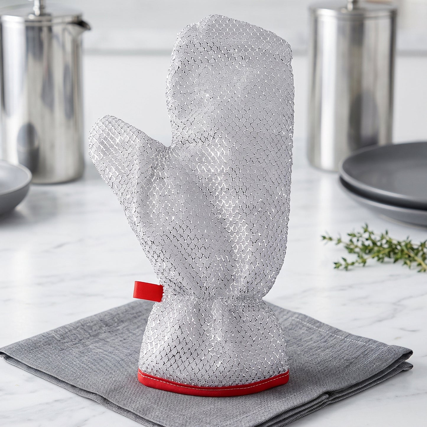 Reusable kitchen glove displayed on a countertop