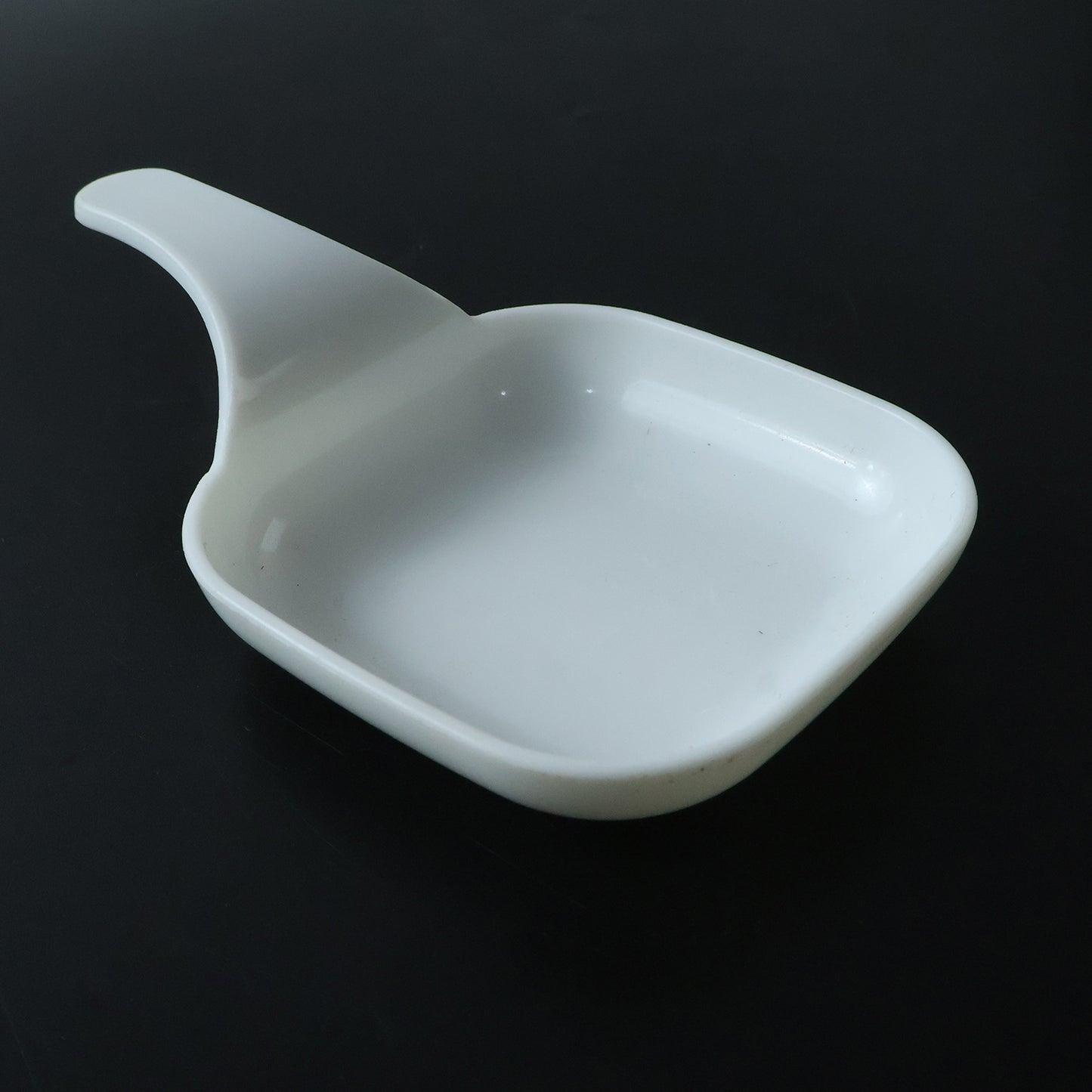 Plastic scoop dish with snacks