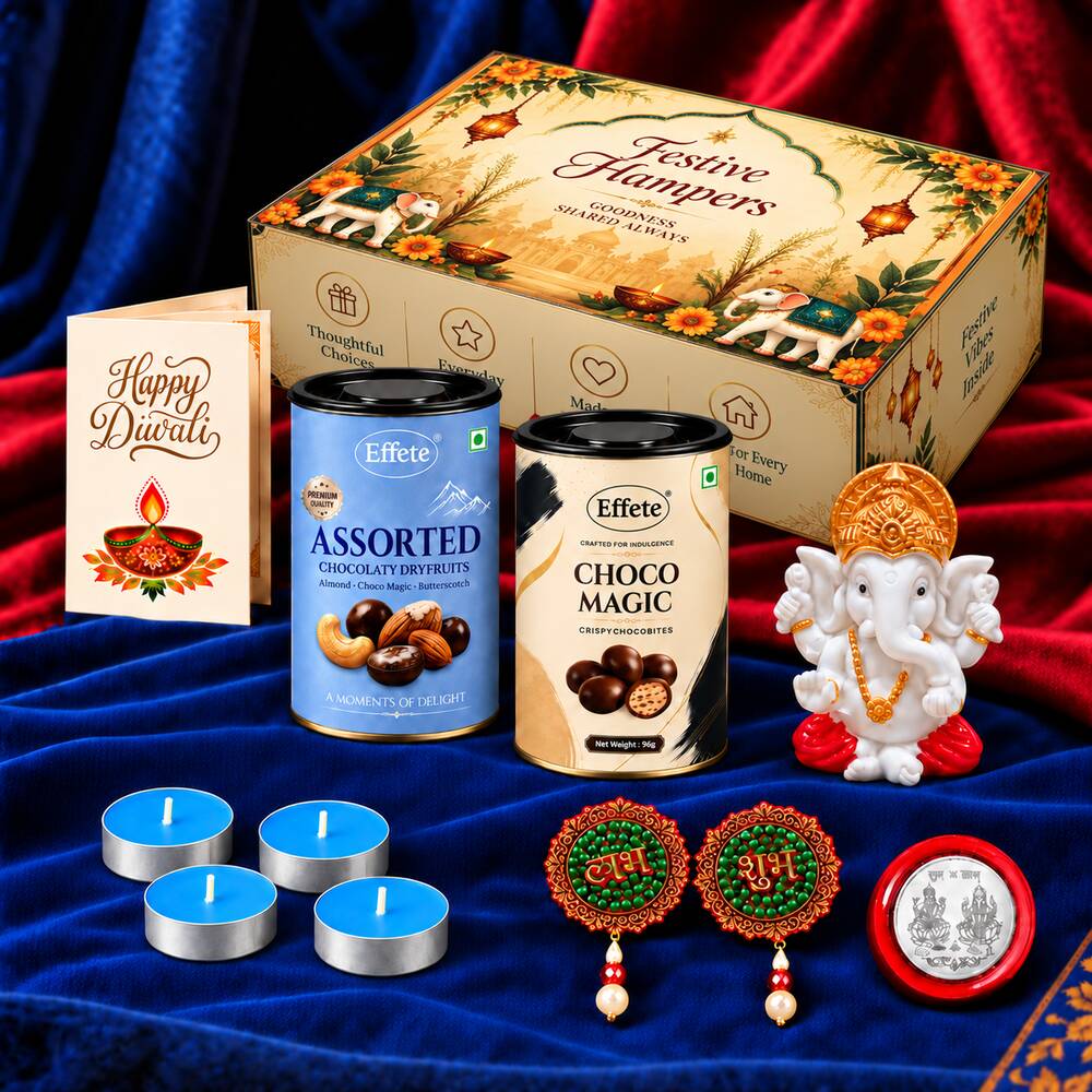 A festive gift box with a Ganesha idol, tealights, decorative hangings, a silver coin, two chocolate tins, and a – view 3