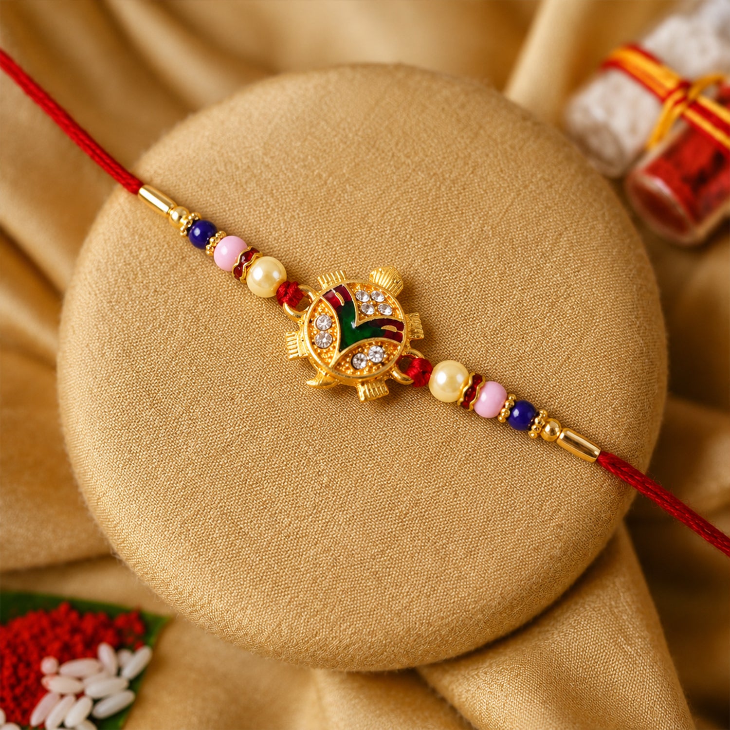 Traditional Tortoise Charm Rakhi close-up