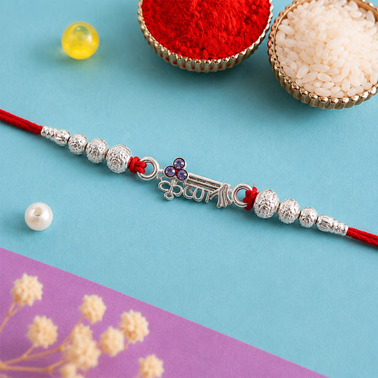 Silver Rakhi – Elegant Traditional Design with Beads and Stones