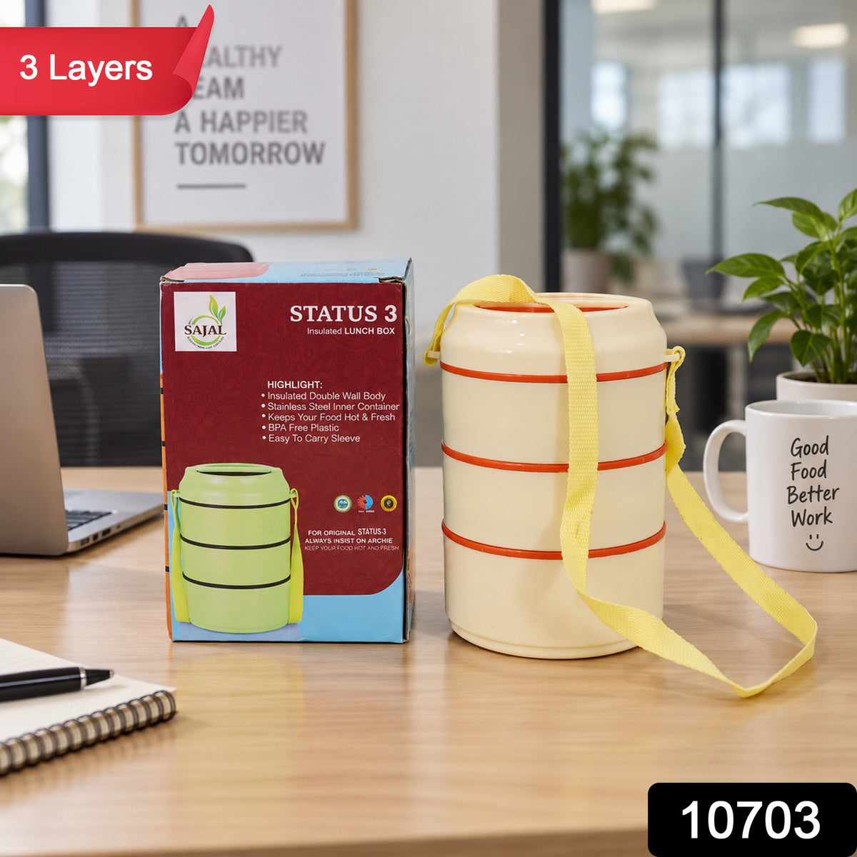The cream-colored three-layer lunch box and its packaging are shown on a desk, with a red "3 Layers" sticker in the corner.