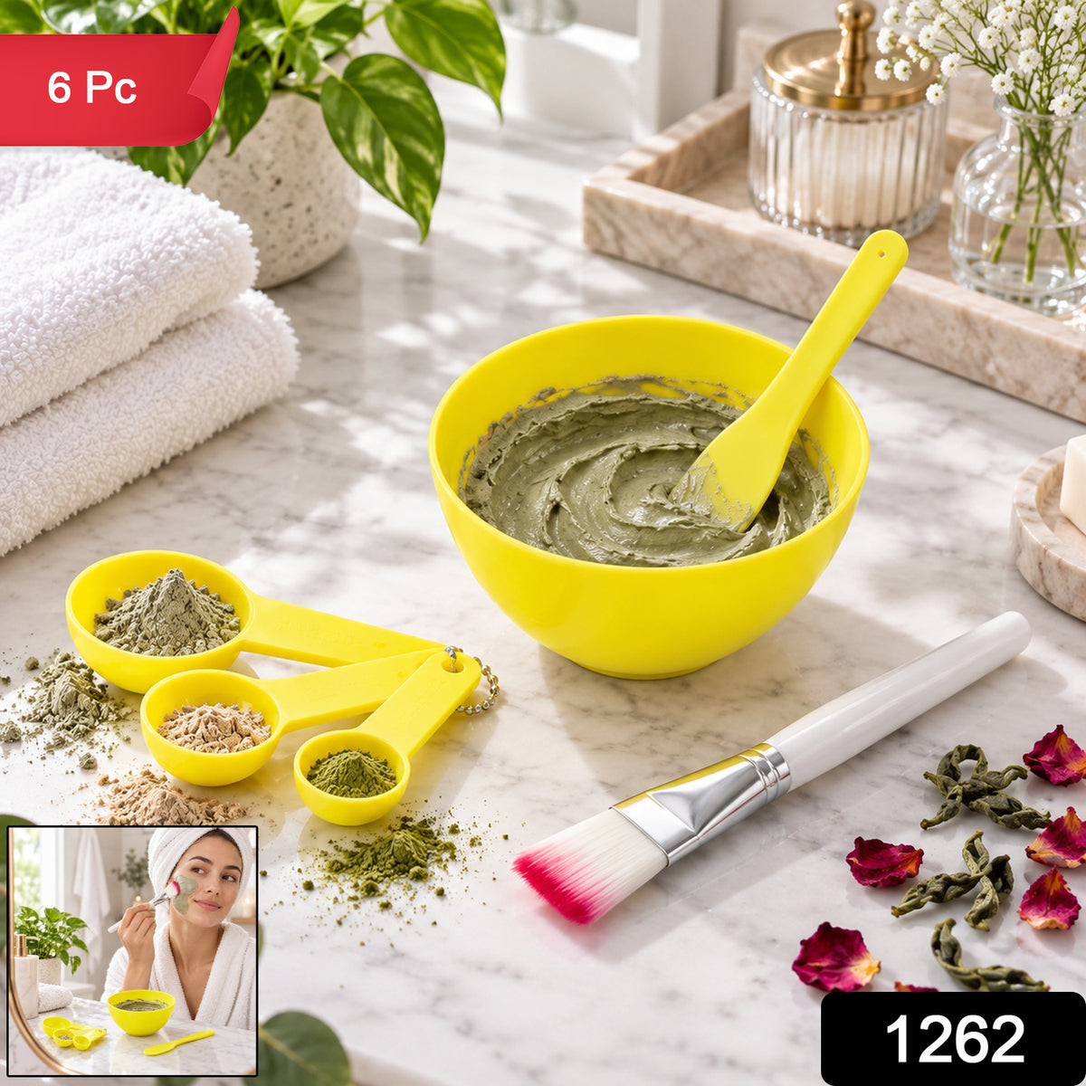 A yellow mixing bowl with a green face mask, a spatula, measuring spoons, and a brush on a marble counter, with an inset of