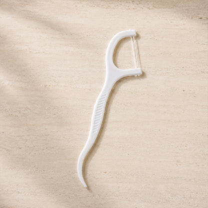 2 in 1 floss toothpick stick on clean background