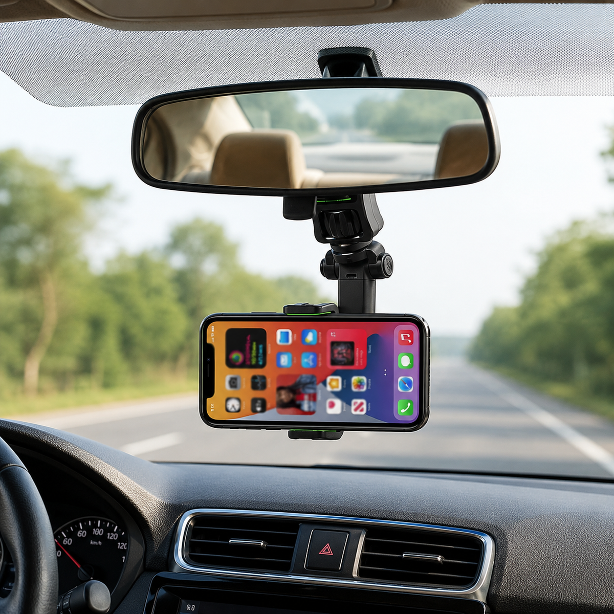 A black and green phone holder attached to a car's rearview mirror, displaying a phone with app icons on its screen.
