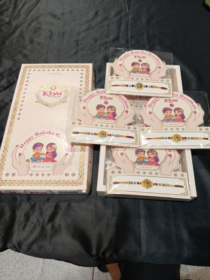 Magnificent Set of Twelve Red-Threaded Rakhis with Golden Embellishments