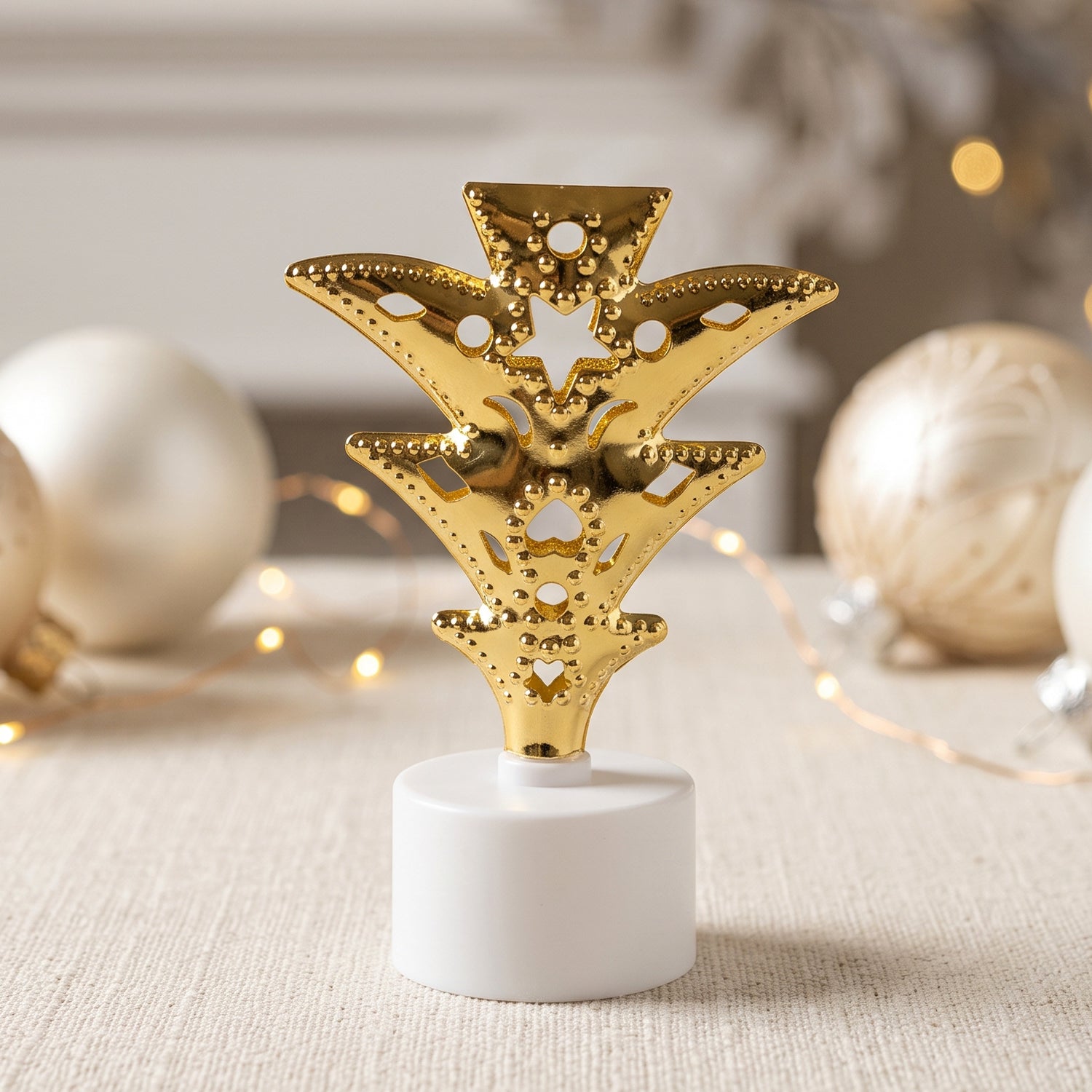 Golden Christmas tree LED tealight candle close-up
