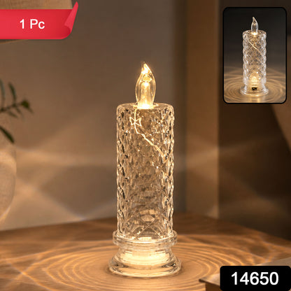 A single clear, faceted crystal LED candle glowing warmly on a wooden surface, casting light patterns.