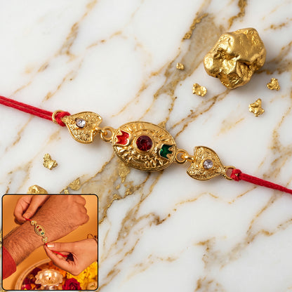 Sacred Bond Designer Gold Rakhi with Ruby & Emerald Stone