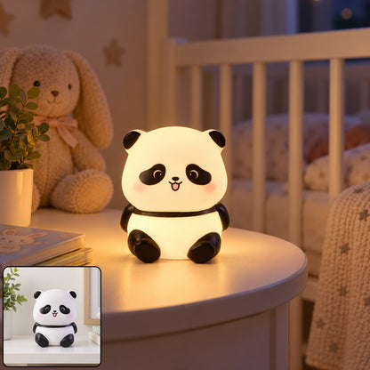 A glowing panda night light with a happy face sits on a white bedside table in a child's room.