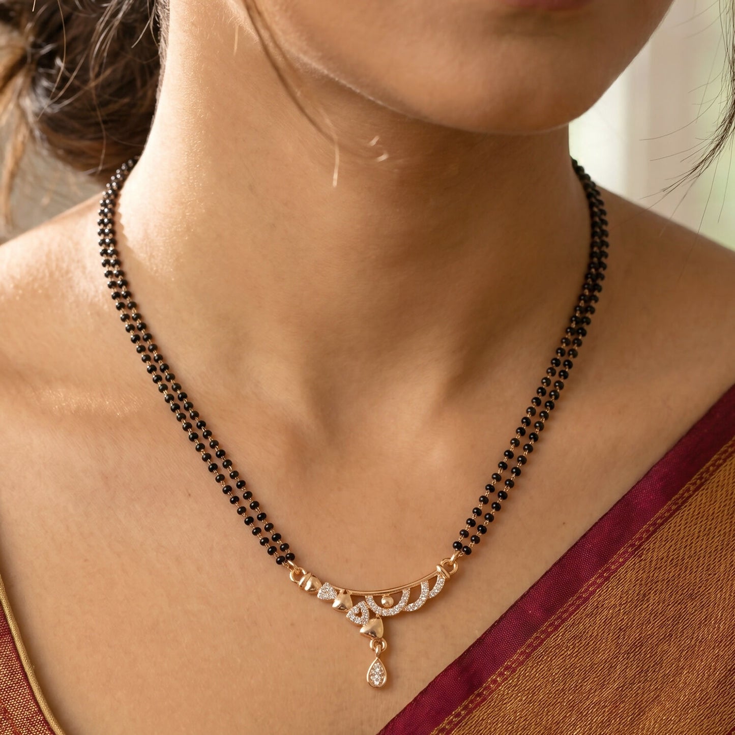 Rose Gold Finish Triple Strand Heart Charms & CZ Bar Mangalsutra with Teardrop Drop