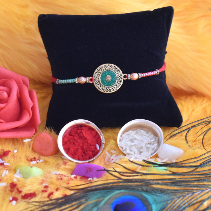 Elegant Rakhi Bracelet Set with Religious Emblems and Ritual Essentials