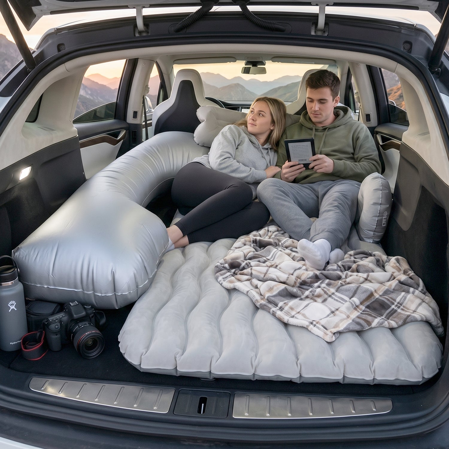 Couple Relaxing on Car Air Mattress in SUV