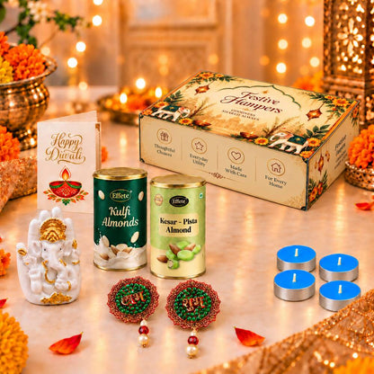 A festive Diwali hamper with Ganesha idol, almond tins, tealights, and decorative earrings on a sparkling table.