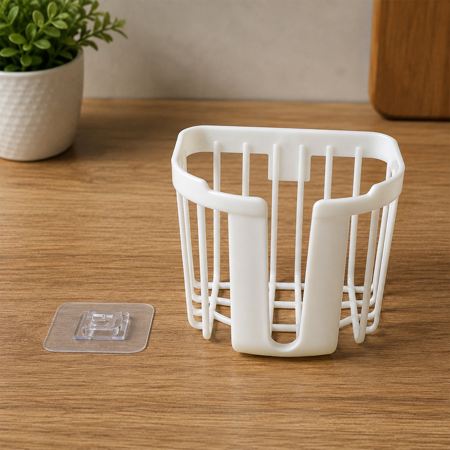 Plastic toilet paper holder with adhesive hook