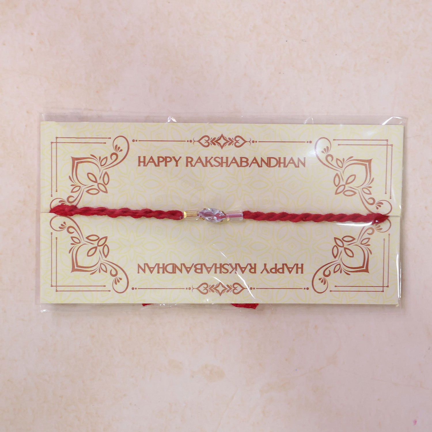 Red Thread Rakhi with Pink and Clear Crystal Bead Pendant Accents