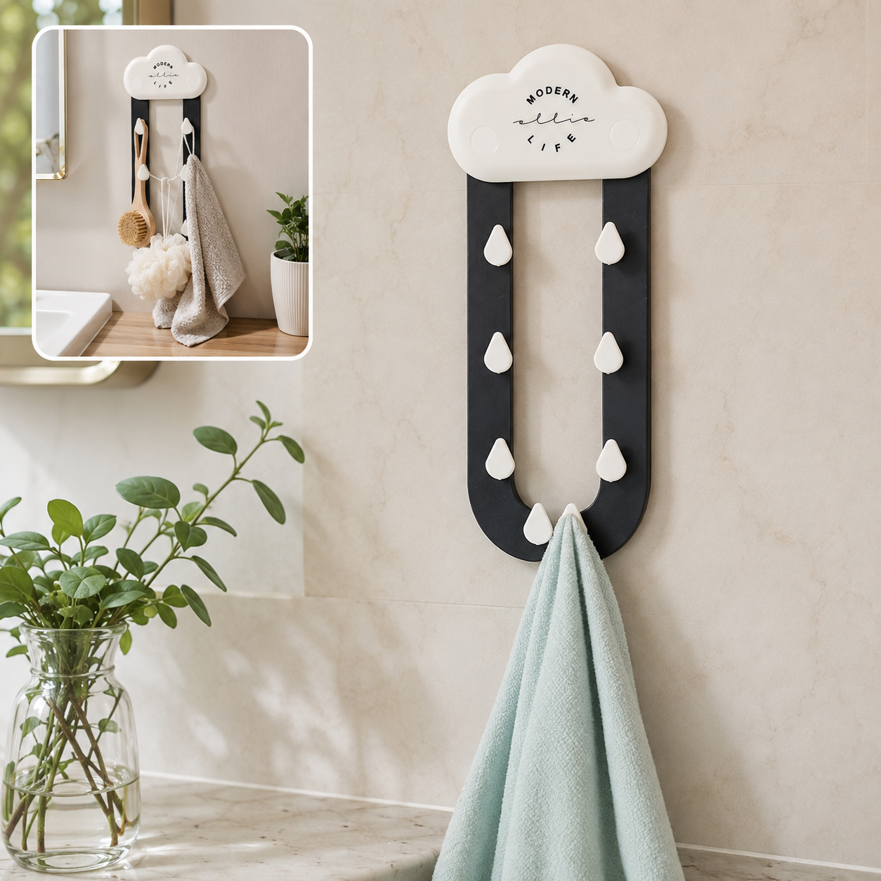 A white cloud-shaped holder with dark grey rain-like arms and white raindrop hooks, holding a light blue towel. A small