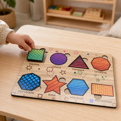 A child's hand places a green square puzzle piece into a wooden shape sorting board.