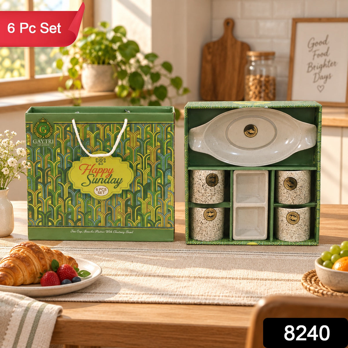 A green and gold gift box with an open box revealing a white ceramic snack and tea set, with a red "6 Pc Set" label.