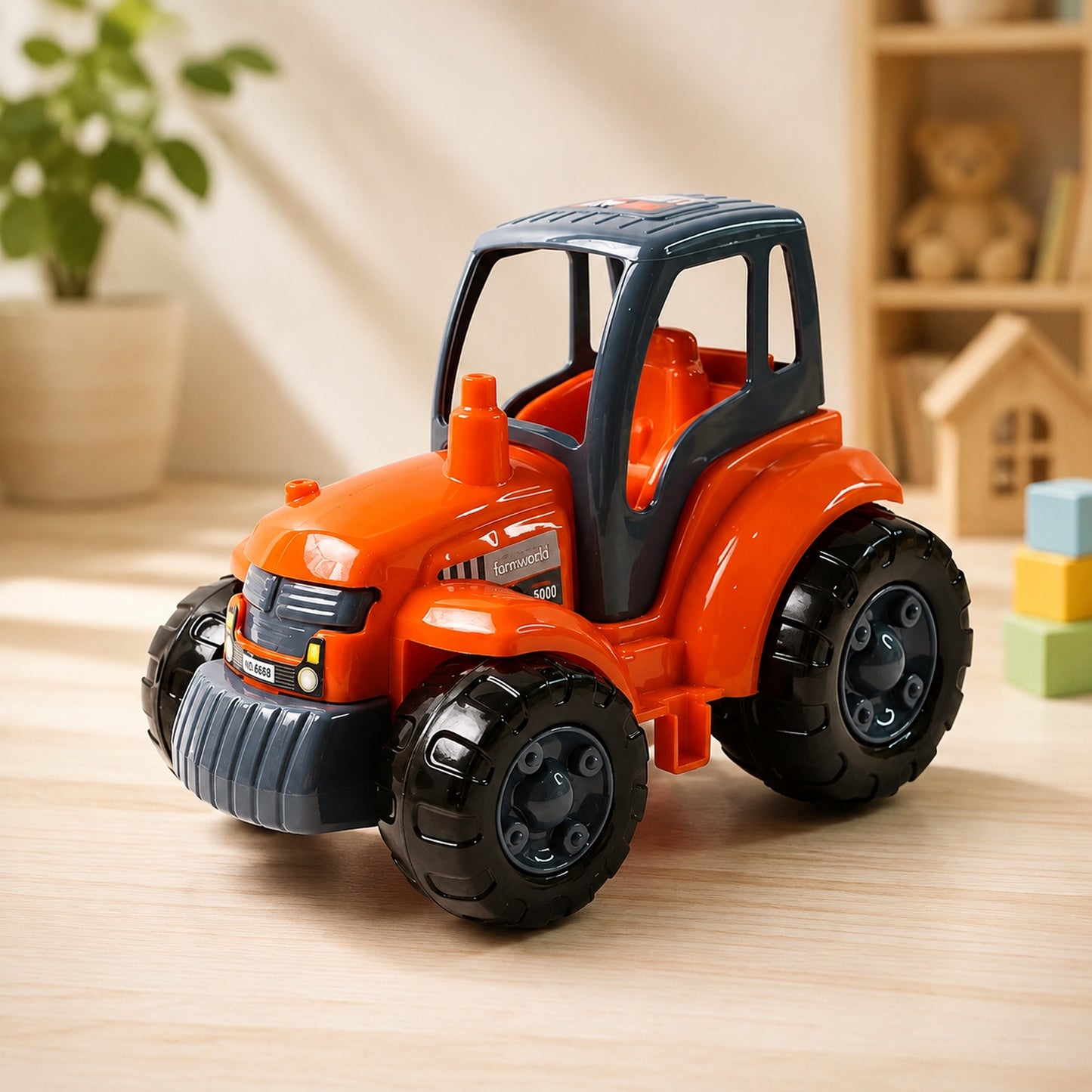 A bright orange and gray plastic toy tractor sits on a light wooden surface with a blurred background.