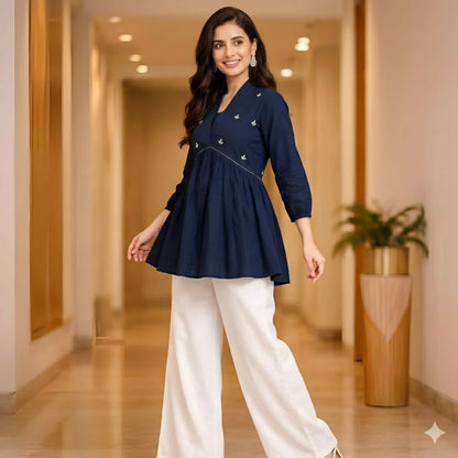 Deep blue cotton embroidered kurti showcasing floral embroidery and flared fit