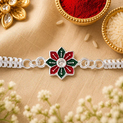 Traditional silver floral rakhi tied on a brother's wrist for Raksha Bandhan