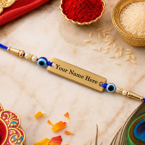 Customized golden nameplate rakhi with evil eye beads for brother on a festive background.