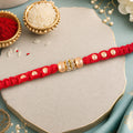 Red Thread Rakhi with Smooth Golden Beads and Sparkling Rhinestone Spacer