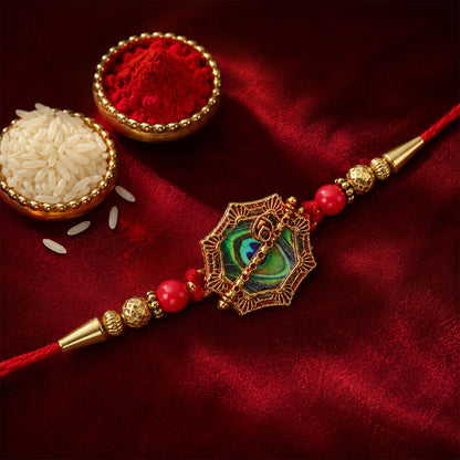 Shop Peacock Feather Rakhi Golden Frame Red Beads (5pcs)