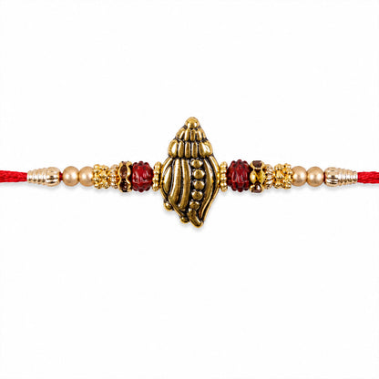 Shankh Conch Golden Devotional Rakhi with Pearl Beads, Red Accents and Antique Finish