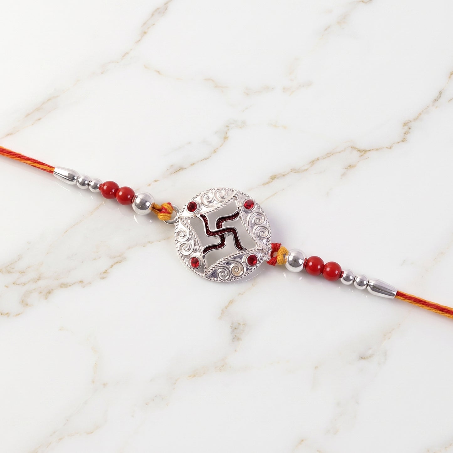 Silver Swastik Stone Rakhi with Red Thread and Handmade Look