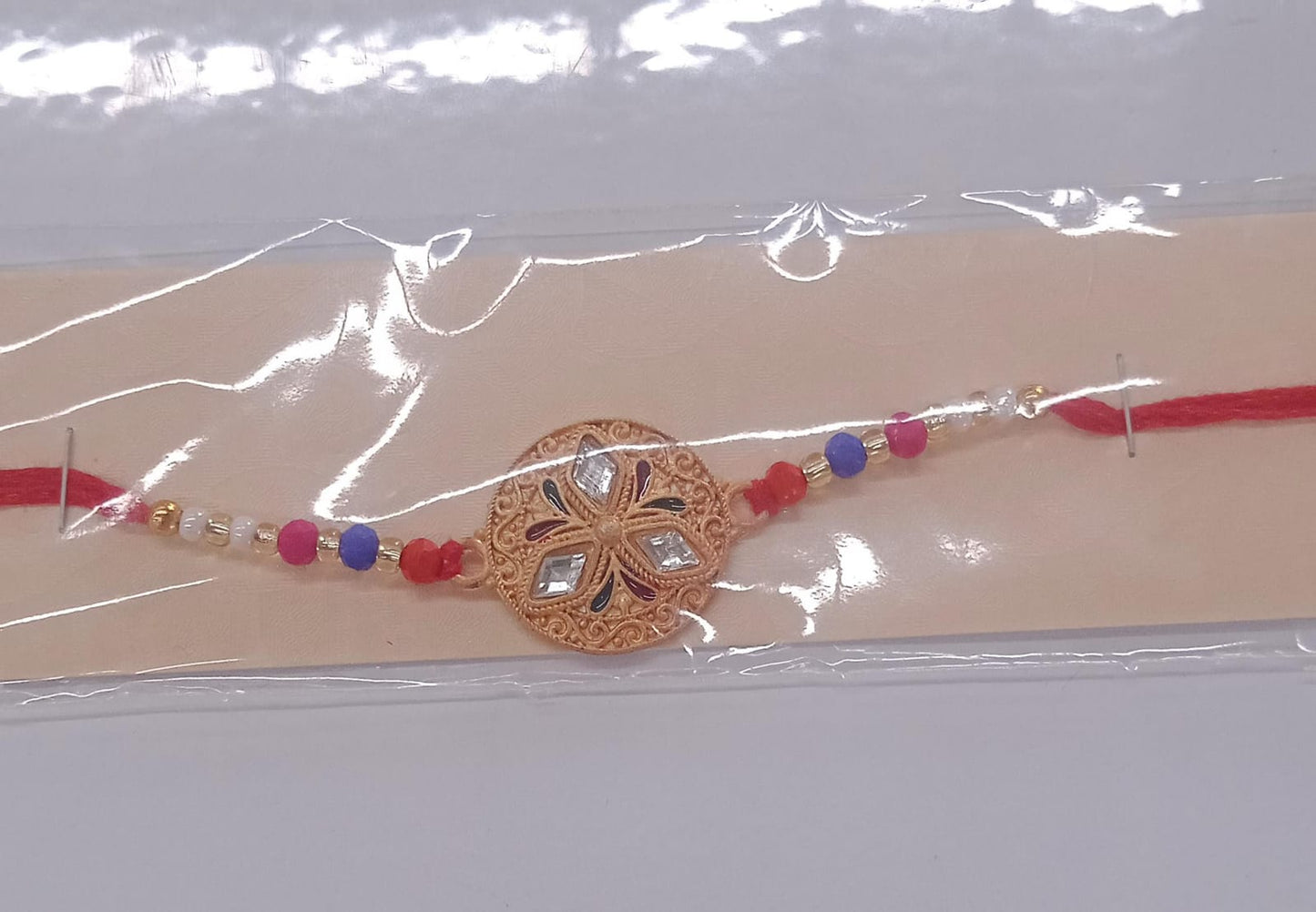 Elegant Meenakari Floral Rakhi with Colorful Beads & Golden Detailing