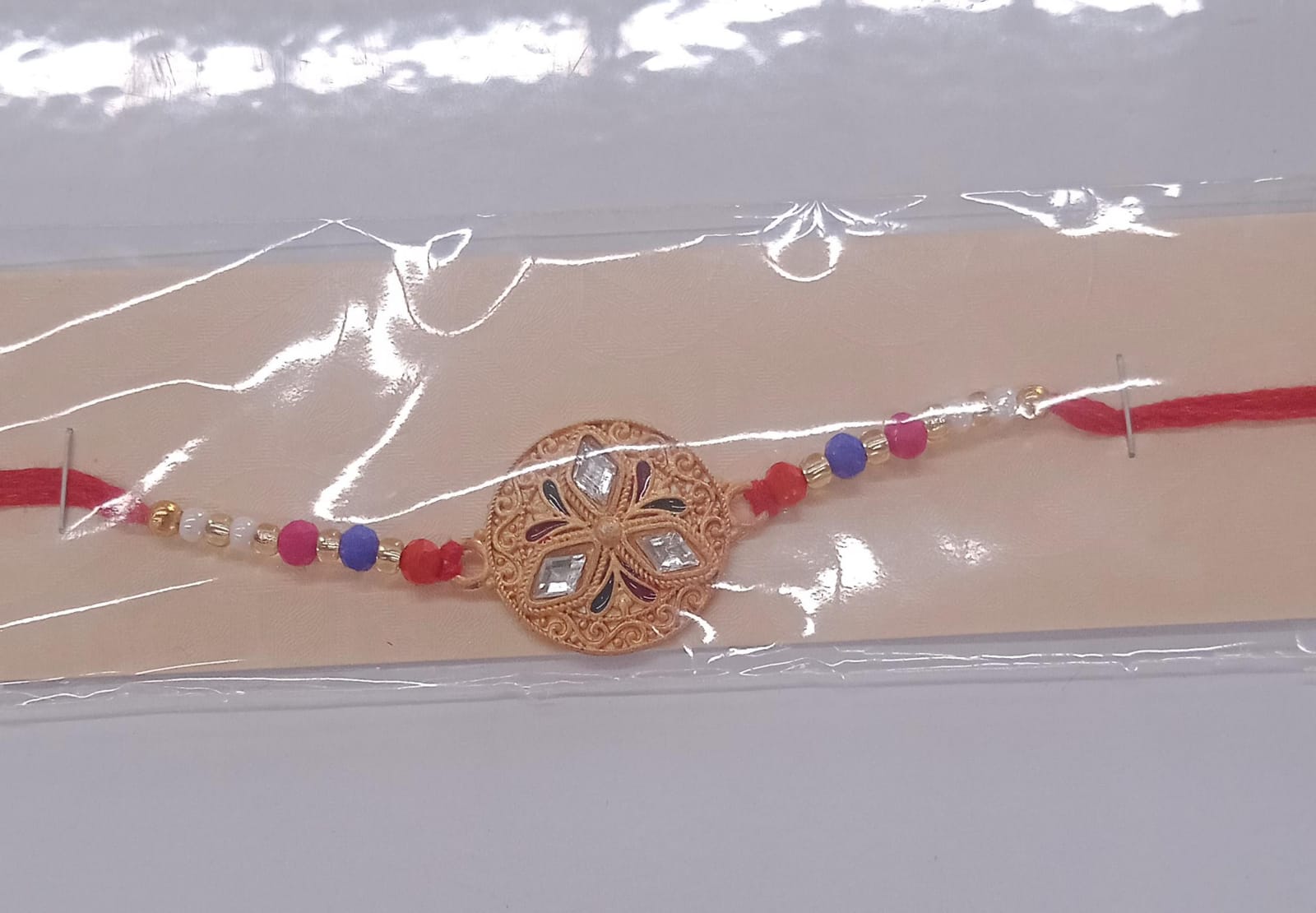Elegant Meenakari Floral Rakhi with Colorful Beads & Golden Detailing