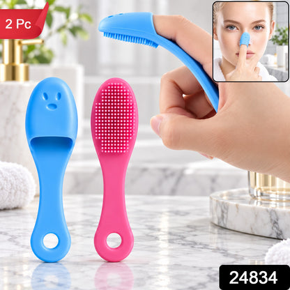 Two silicone facial brushes, blue and pink, stand on a marble counter, with a hand demonstrating use and a "2 Pc" label.