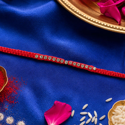 Red Thread Rakhi with a Row of Sparkling Crystal Rhinestone Beads