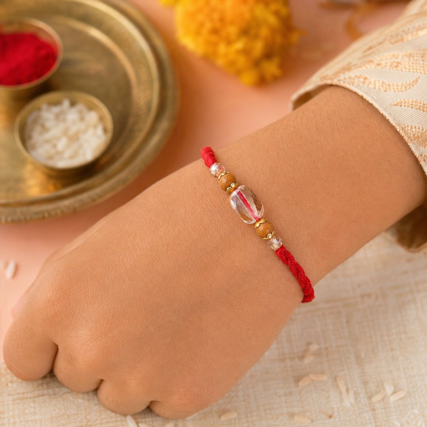 Red Thread Rakhi with Wooden and Sparkling Crystal Bead Pendant