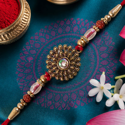 Oxidized Gold Floral Sunburst Pendant Rakhi with Rudraksha and Pearl Beads