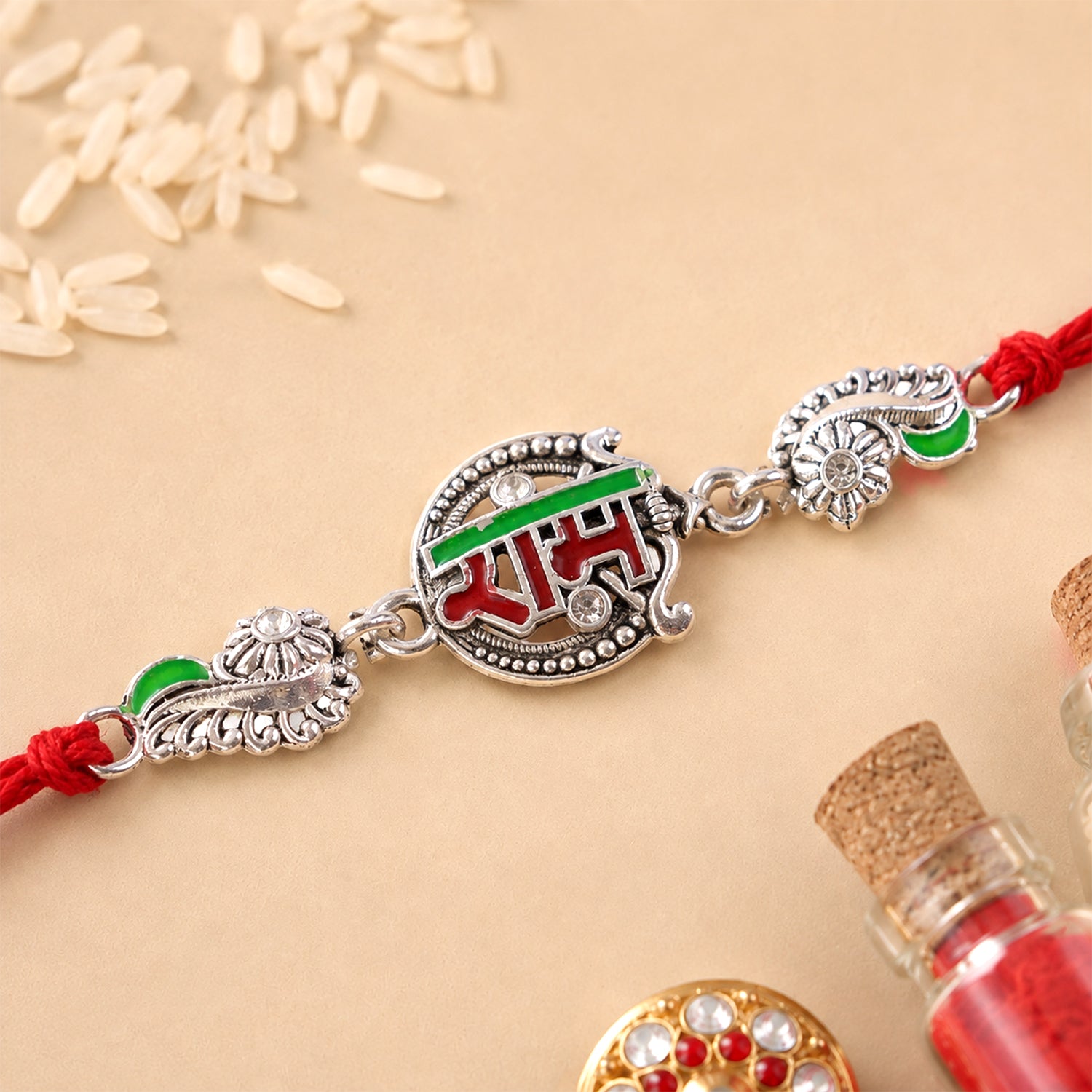Silver-Toned Ram Rakhi with Red & Green Enamel and Crystal Accents for Brother
