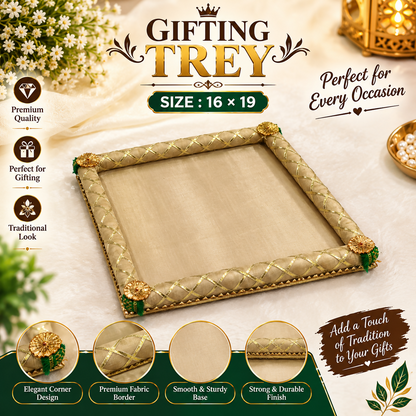 A rectangular gift tray with a beige fabric base and a gold braided border, adorned with green and gold corner