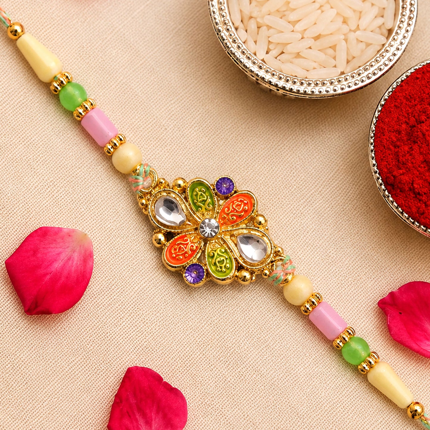 Orange and Green Enamel Flower Pendant Rakhi with Kundan Teardrop Stones