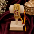 Heritage Rajasthani Golden Bead Poochi Bracelet with Ruby Star Medallion