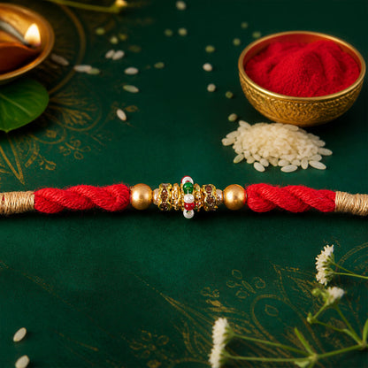 Red Twisted Cord Rakhi with a Colourful Enamel Bead and Gold Accents