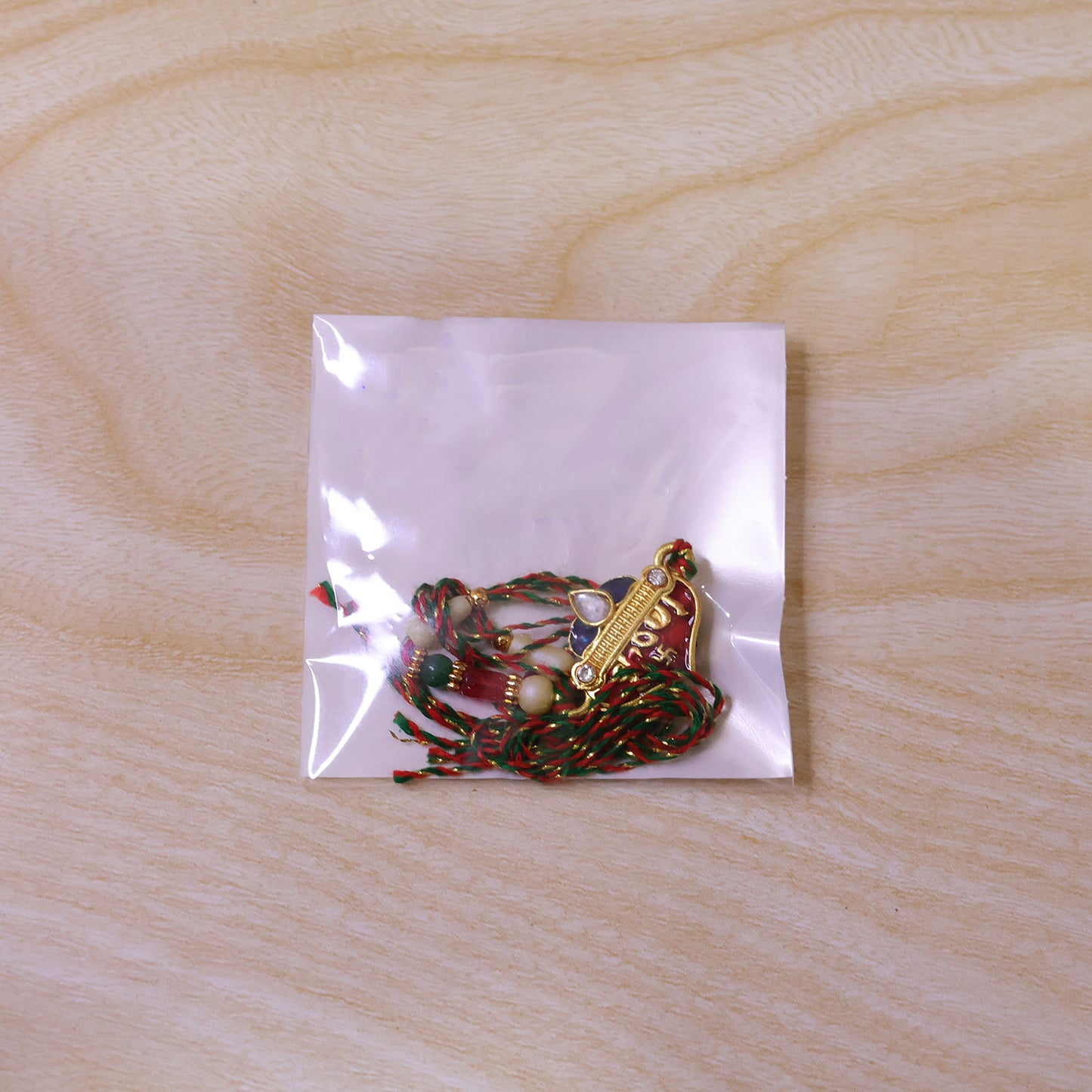Elegant Rakhi featuring Ram Heart Plaque and ornate work in display look for Gift Use
