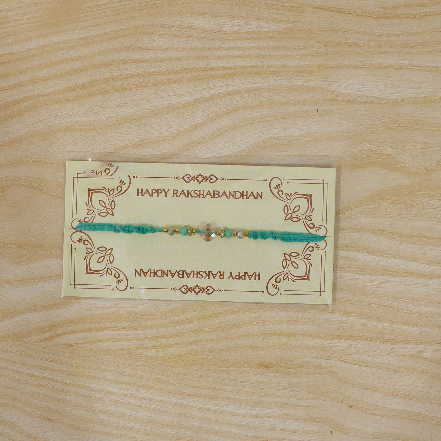 Elegant Stone Work Rakhi with Red Thread, Bead Detailing and Premium Celebration Look