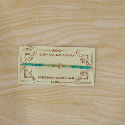 Elegant Stone Work Rakhi with Red Thread, Bead Detailing and Premium Celebration Look