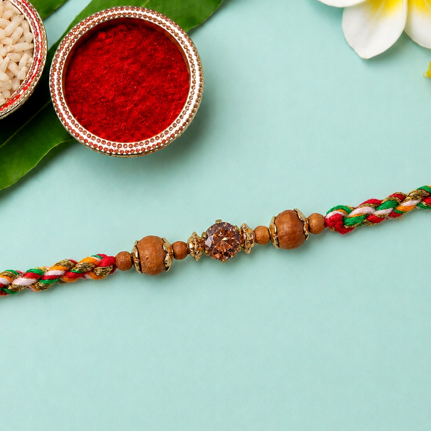 Vibrant Stone Rakhi with Color Beads, Gold Accents and Festive Thread Beauty
