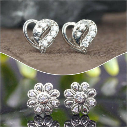 Set of two pairs of silver heart and flower stud earrings with sparkling cubic zirconia stones