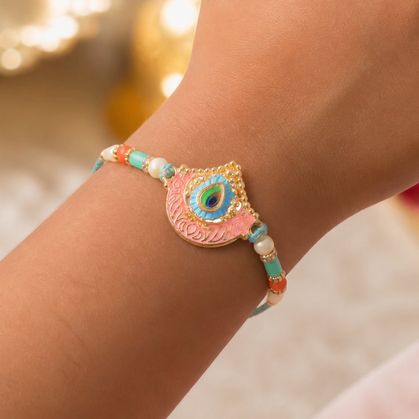 Peacock Feather Crown Pendant Rakhi with Pink Enamel