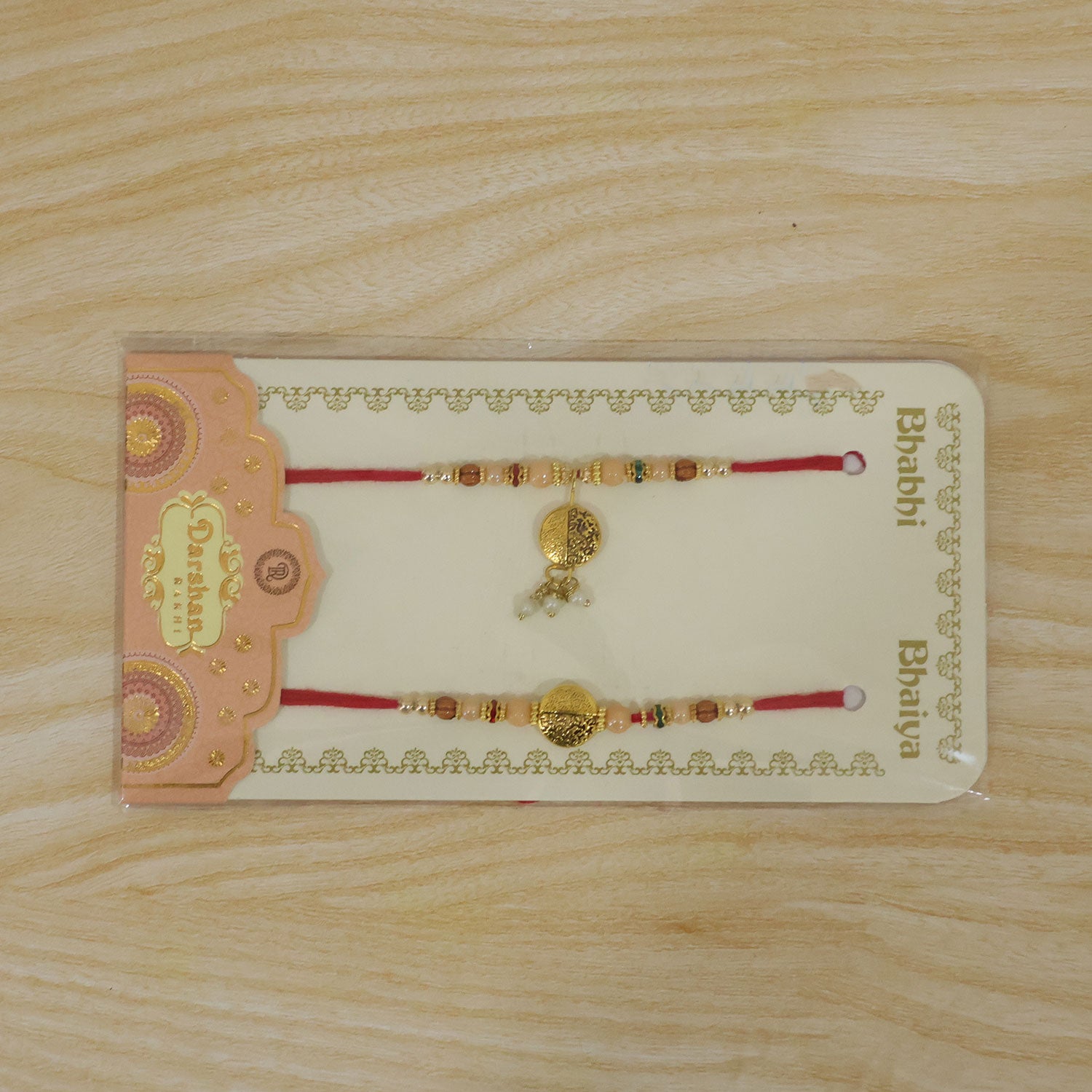 Couple Rakhi with Gold Coin Charm, Pearl Drop and Multicolor Bead Accents